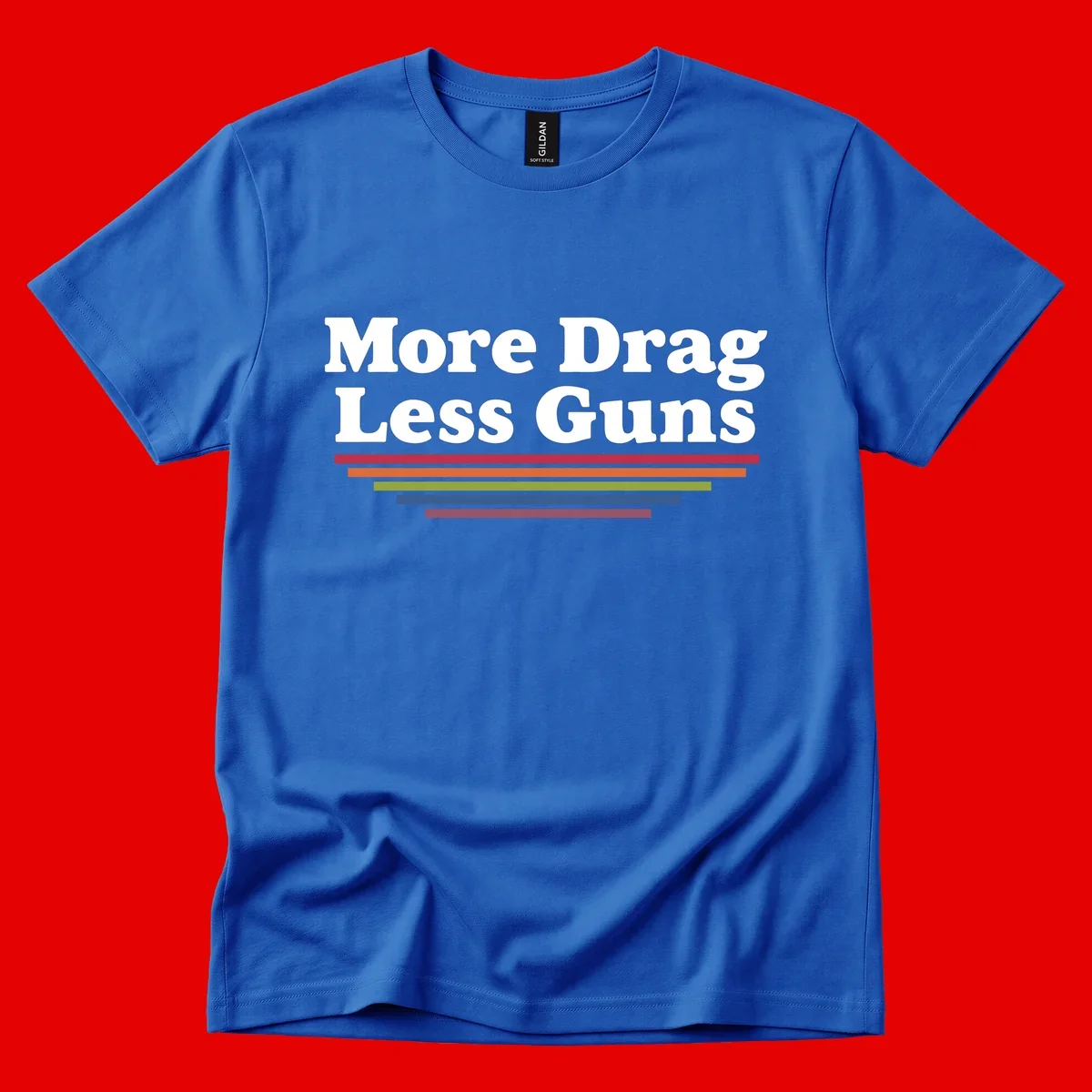 Bold white text reading 'More Drag Less Guns' with colorful horizontal bars below on gray background