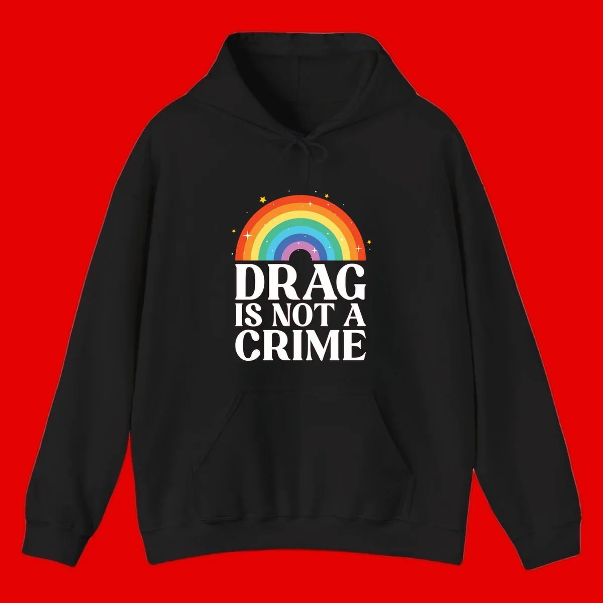 Rainbow arc with stars and text reading 'Drag Is Not A Crime' - a pride-themed design celebrating drag rights and LGBTQ+ equality
