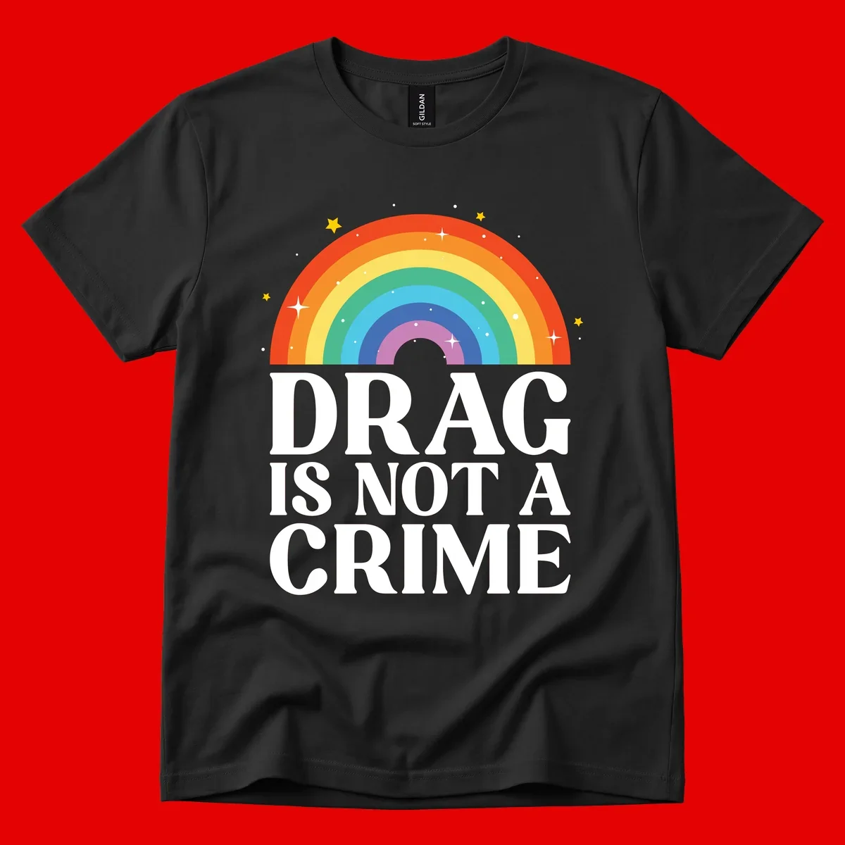 Rainbow arc with stars and text reading 'Drag Is Not A Crime' - a pride-themed design celebrating drag rights and LGBTQ+ equality