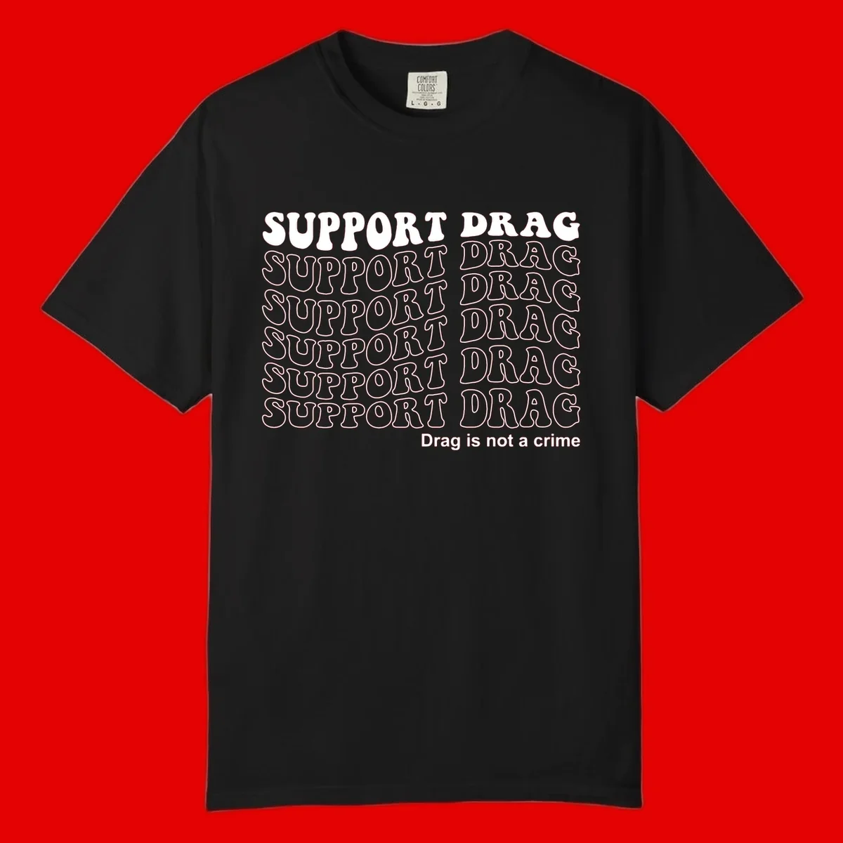 Gray shirt design with white text reading 'Support Drag' repeated vertically and 'Drag is not a crime' at bottom