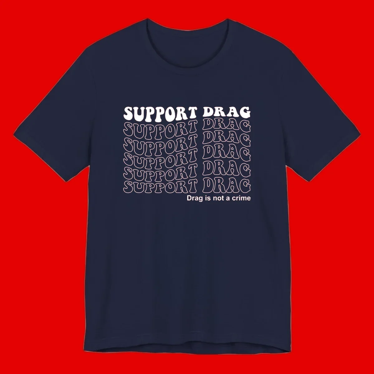 Gray shirt design with white text reading 'Support Drag' repeated vertically and 'Drag is not a crime' at bottom