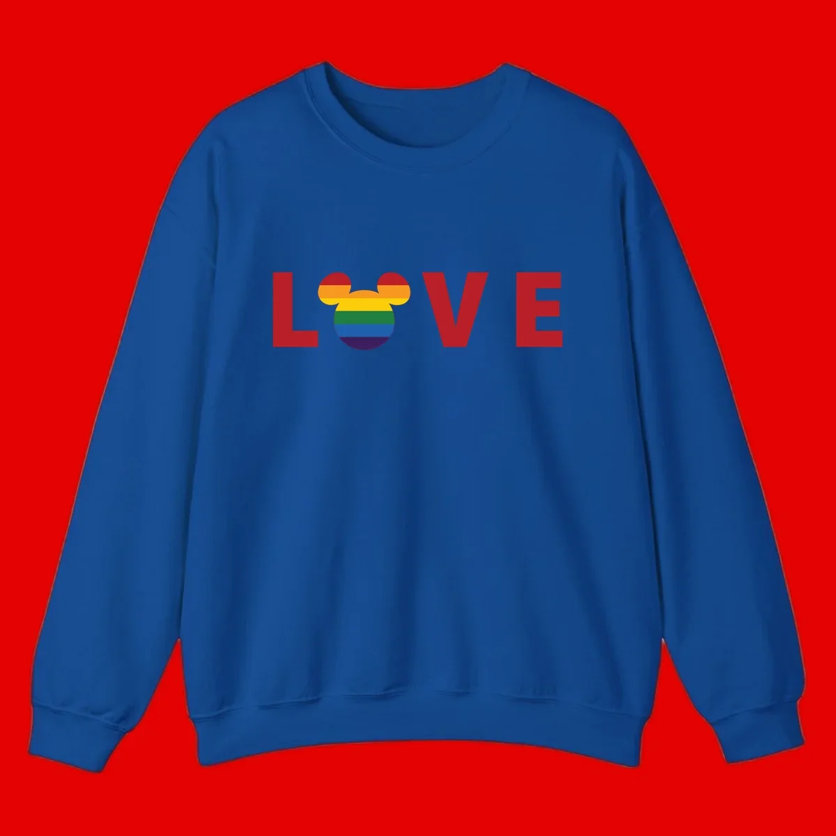 Love pride mouse ears design with rainbow-striped Mickey head icon and colorful pride flag stripes on gray background