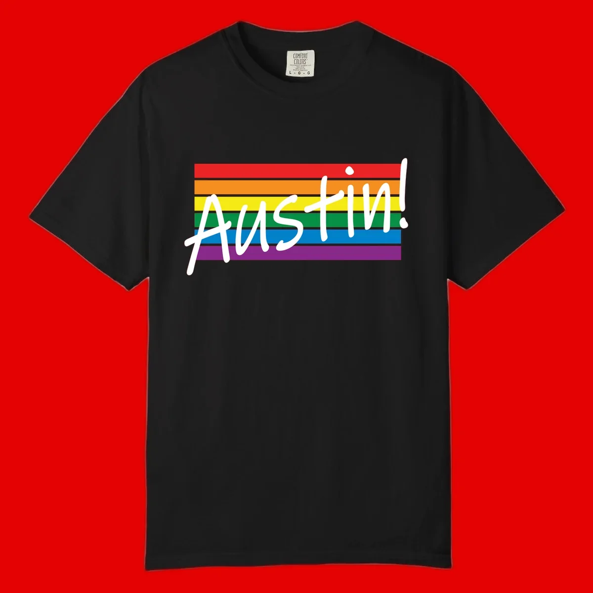Austin pride rainbow flag design with white handwritten text overlaid on six horizontal rainbow stripes
