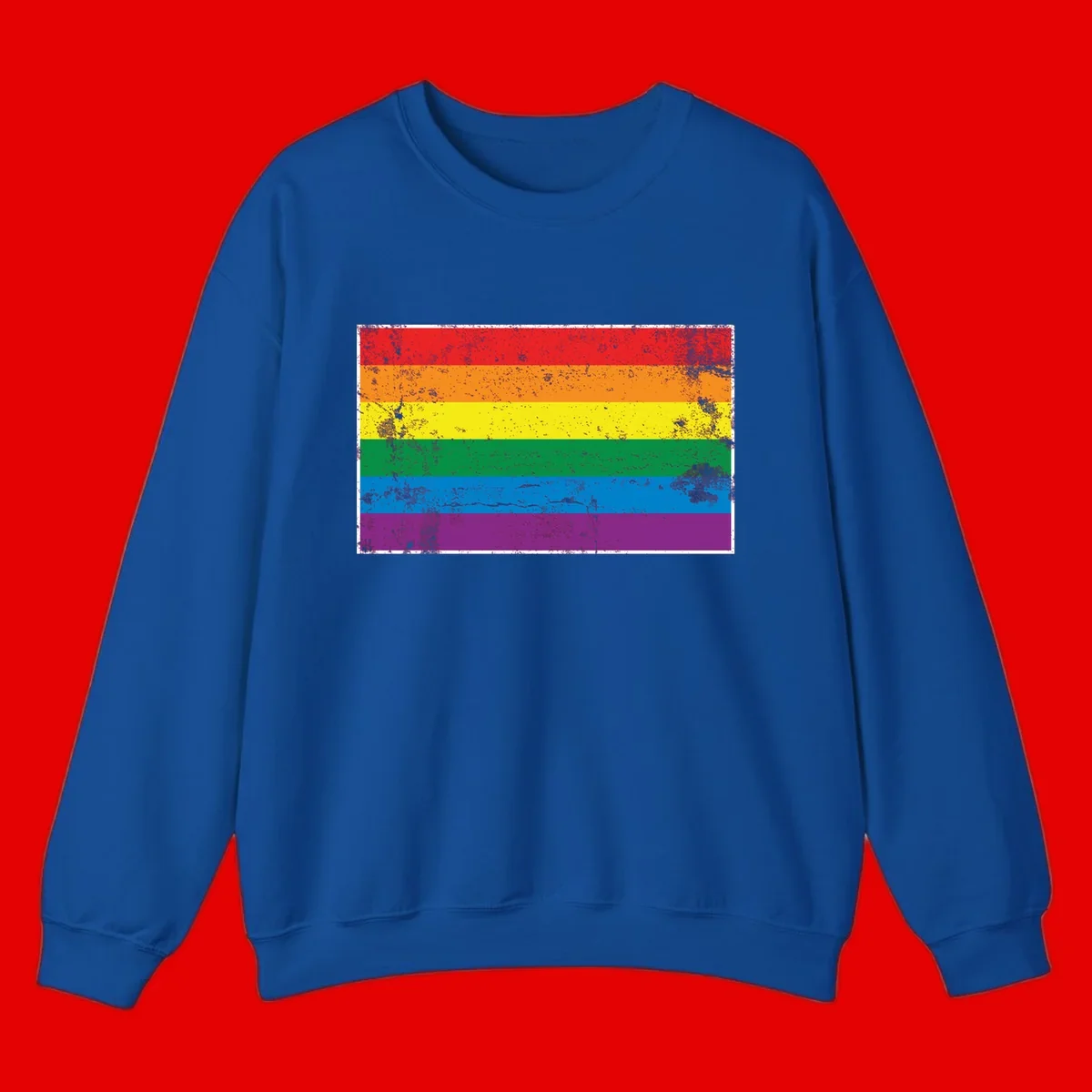 Distressed rainbow pride flag with six horizontal color stripes: red, orange, yellow, green, blue, and purple with grunge texture