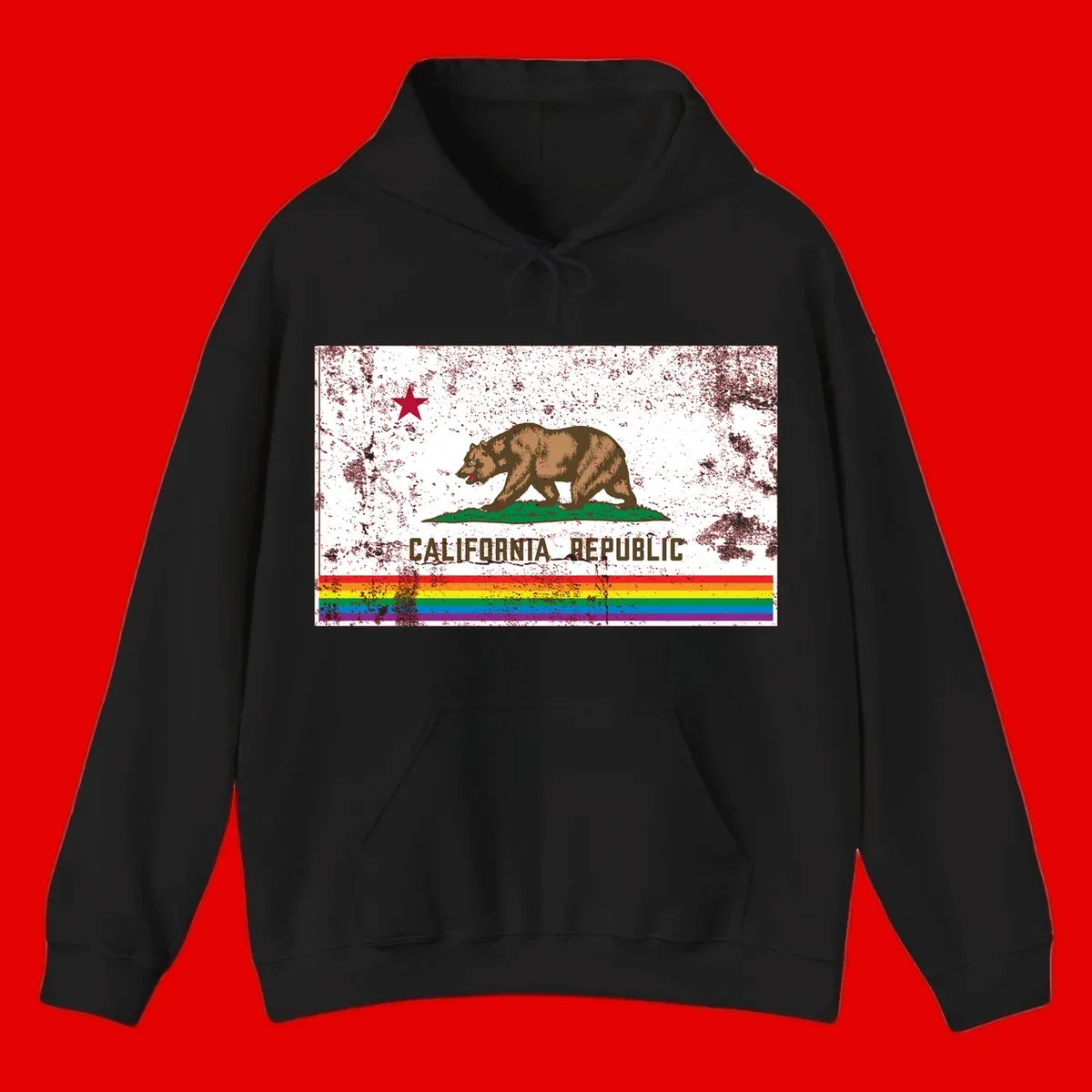 Distressed vintage California Republic flag bear with raised paw on green grass, red star above, CALIFORNIA REPUBLIC text, and rainbow pride stripes below