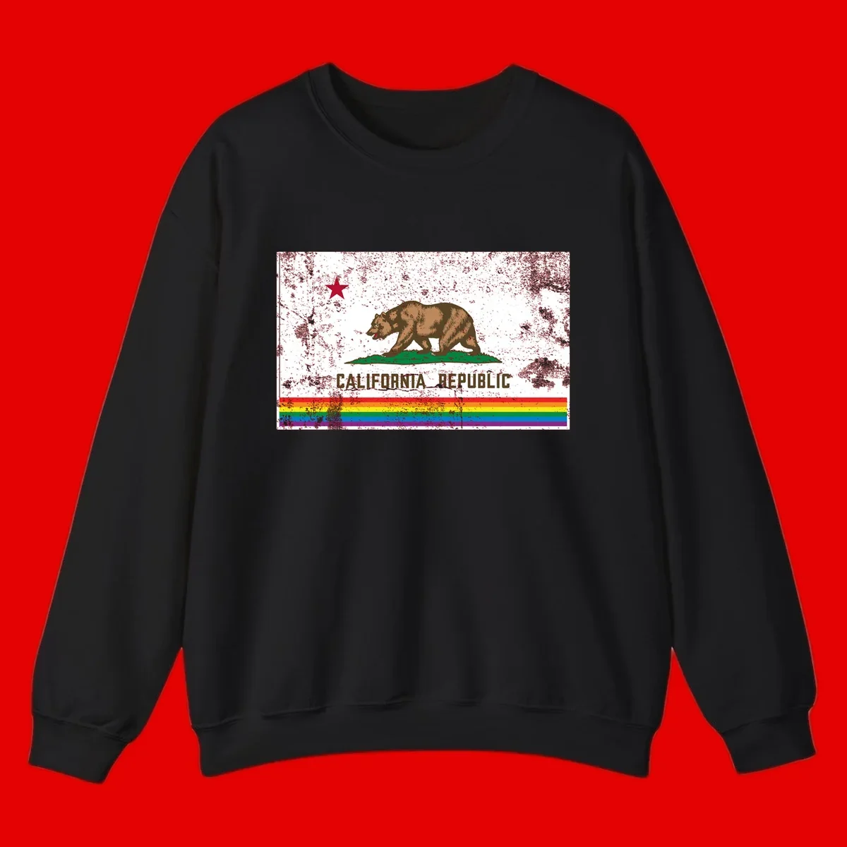 Distressed vintage California Republic flag bear with raised paw on green grass, red star above, CALIFORNIA REPUBLIC text, and rainbow pride stripes below
