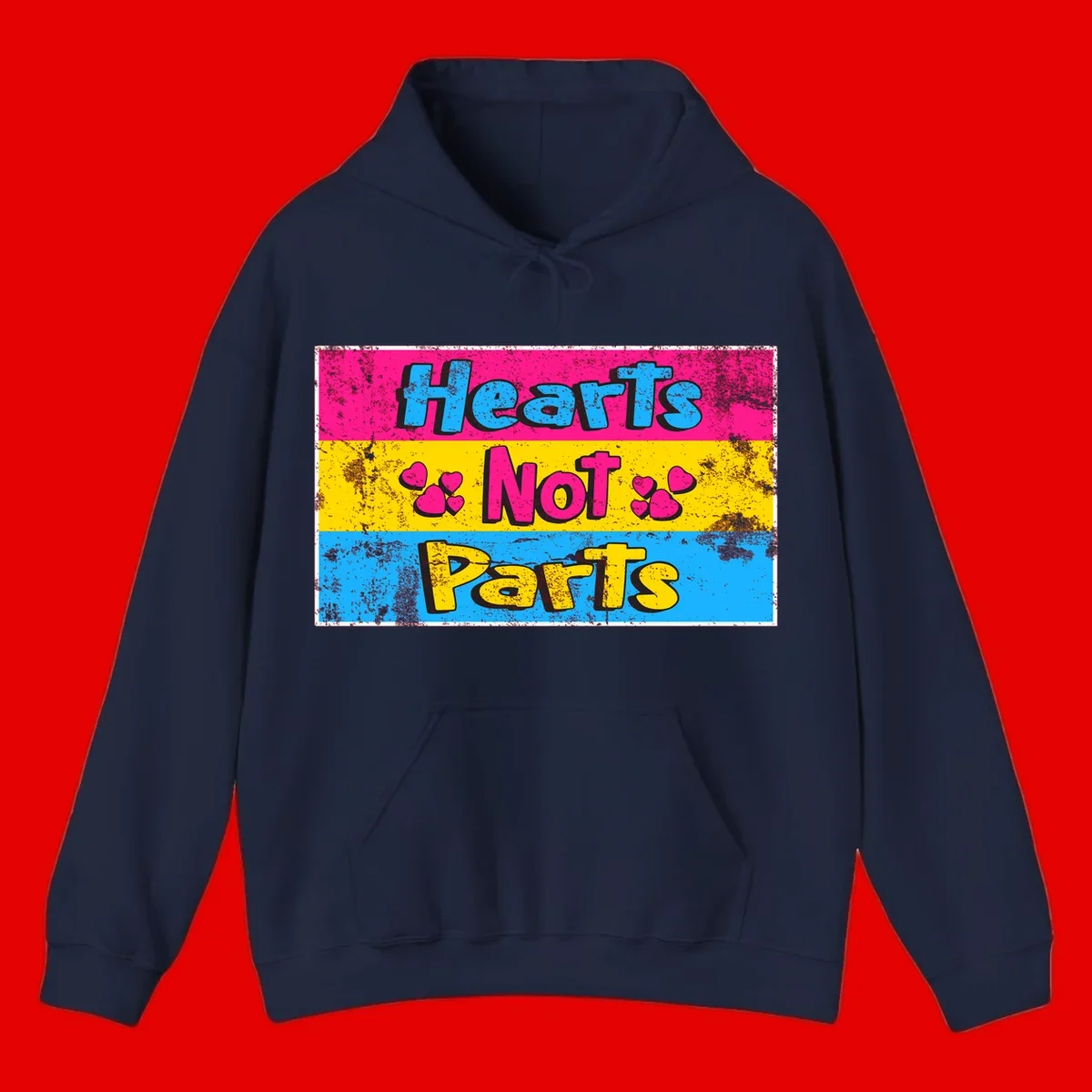 Hearts Not Parts design: magenta, yellow, and blue color-blocked graphic with distressed typography and pink hearts celebrating trans and non-binary identity