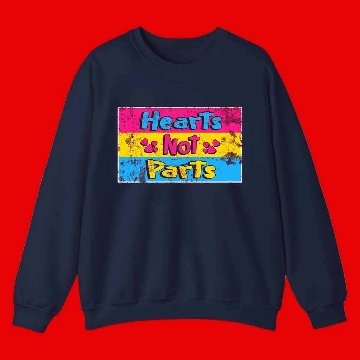 Hearts Not Parts design: magenta, yellow, and blue color-blocked graphic with distressed typography and pink hearts celebrating trans and non-binary identity