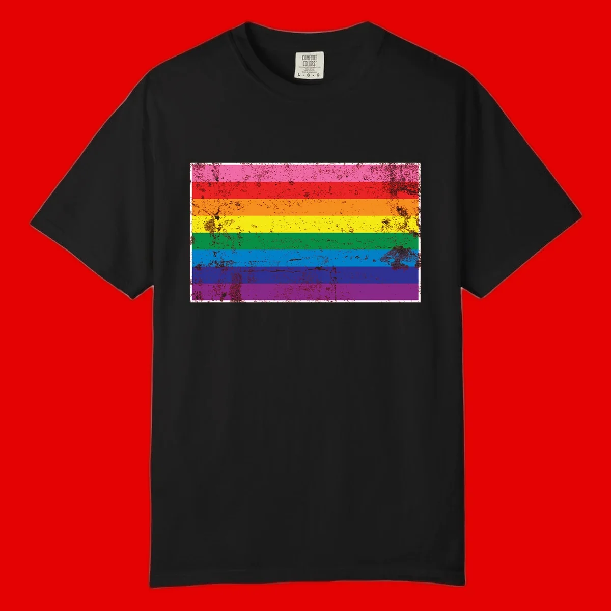 Distressed rainbow pride flag with horizontal stripes in pink, red, orange, yellow, green, blue, purple, and magenta featuring grunge texture overlay.