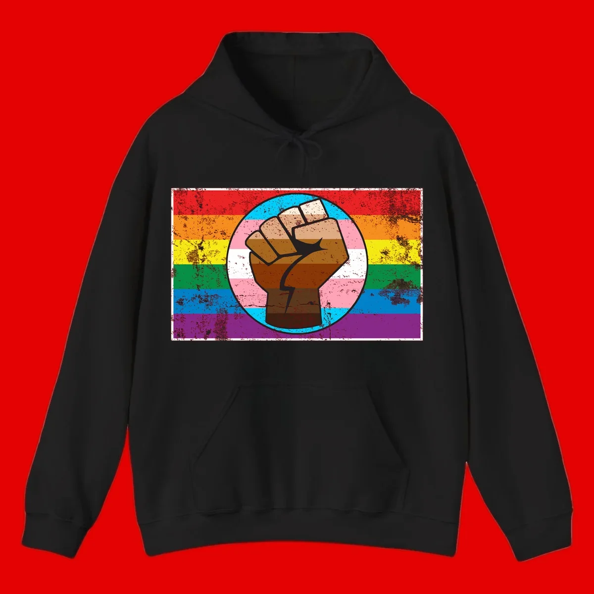 Raised brown fist in circular badge with rainbow pride flag and trans flag stripe background symbolizing LGBTQ+ solidarity