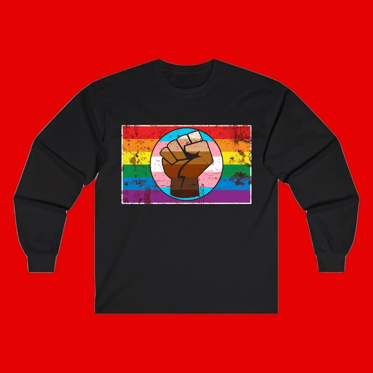 Raised brown fist in circular badge with rainbow pride flag and trans flag stripe background symbolizing LGBTQ+ solidarity