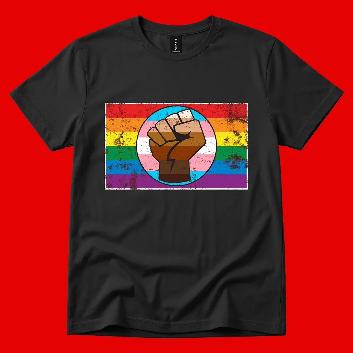 Raised brown fist in circular badge with rainbow pride flag and trans flag stripe background symbolizing LGBTQ+ solidarity