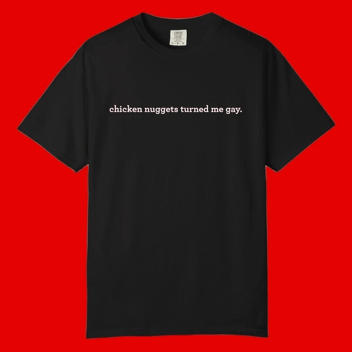 White text reading 'chicken nuggets turned me gay' on gray background - humorous pride design