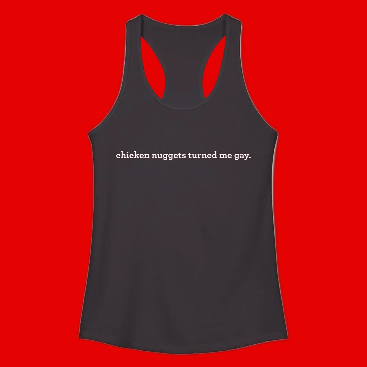 White text reading 'chicken nuggets turned me gay' on gray background - humorous pride design