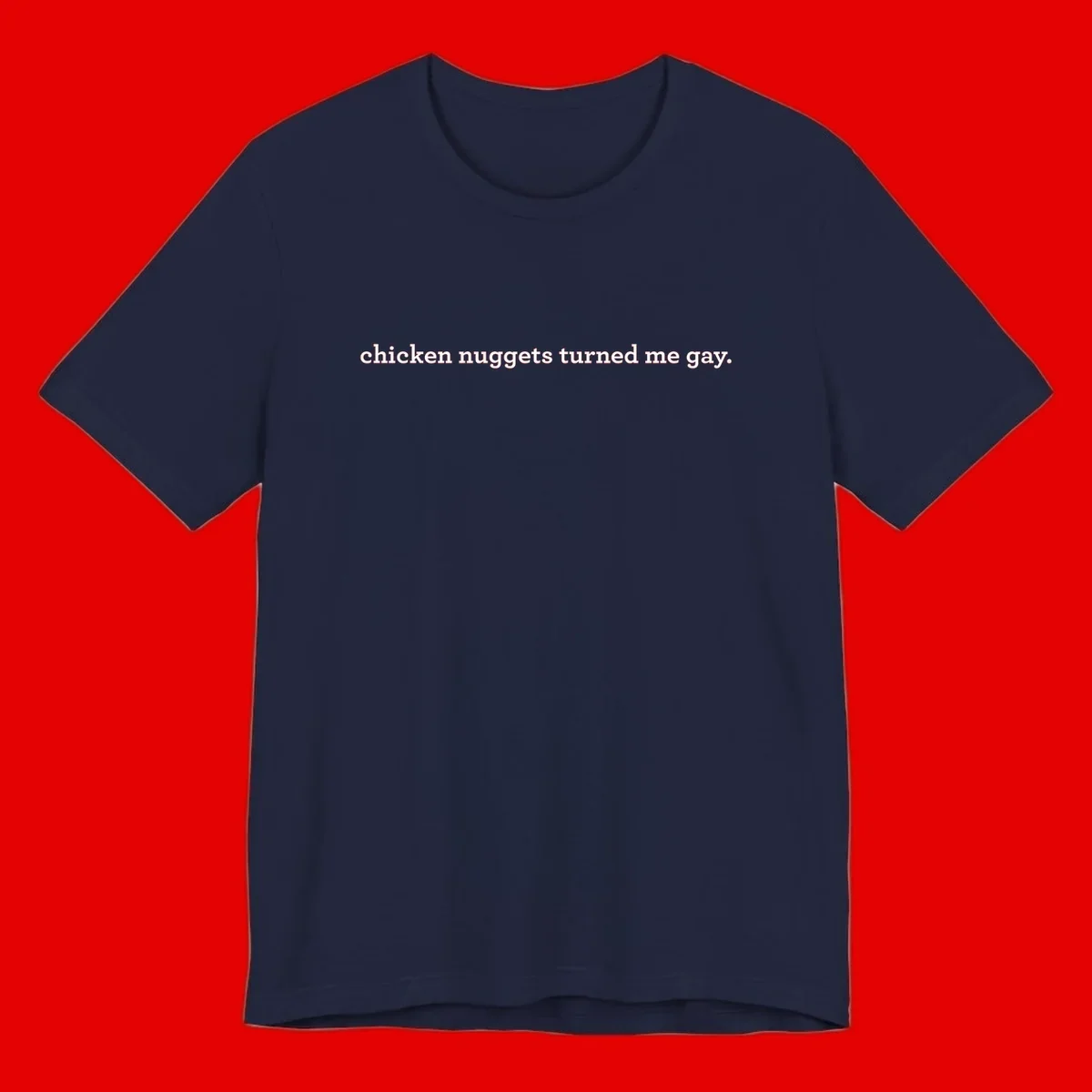 White text reading 'chicken nuggets turned me gay' on gray background - humorous pride design