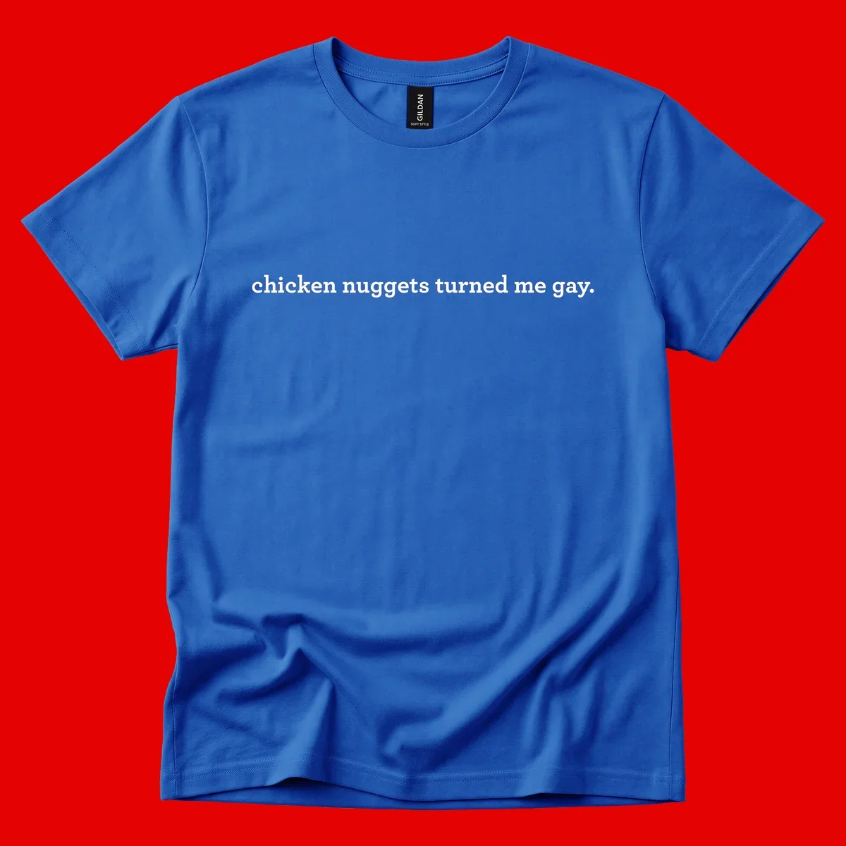 White text reading 'chicken nuggets turned me gay' on gray background - humorous pride design