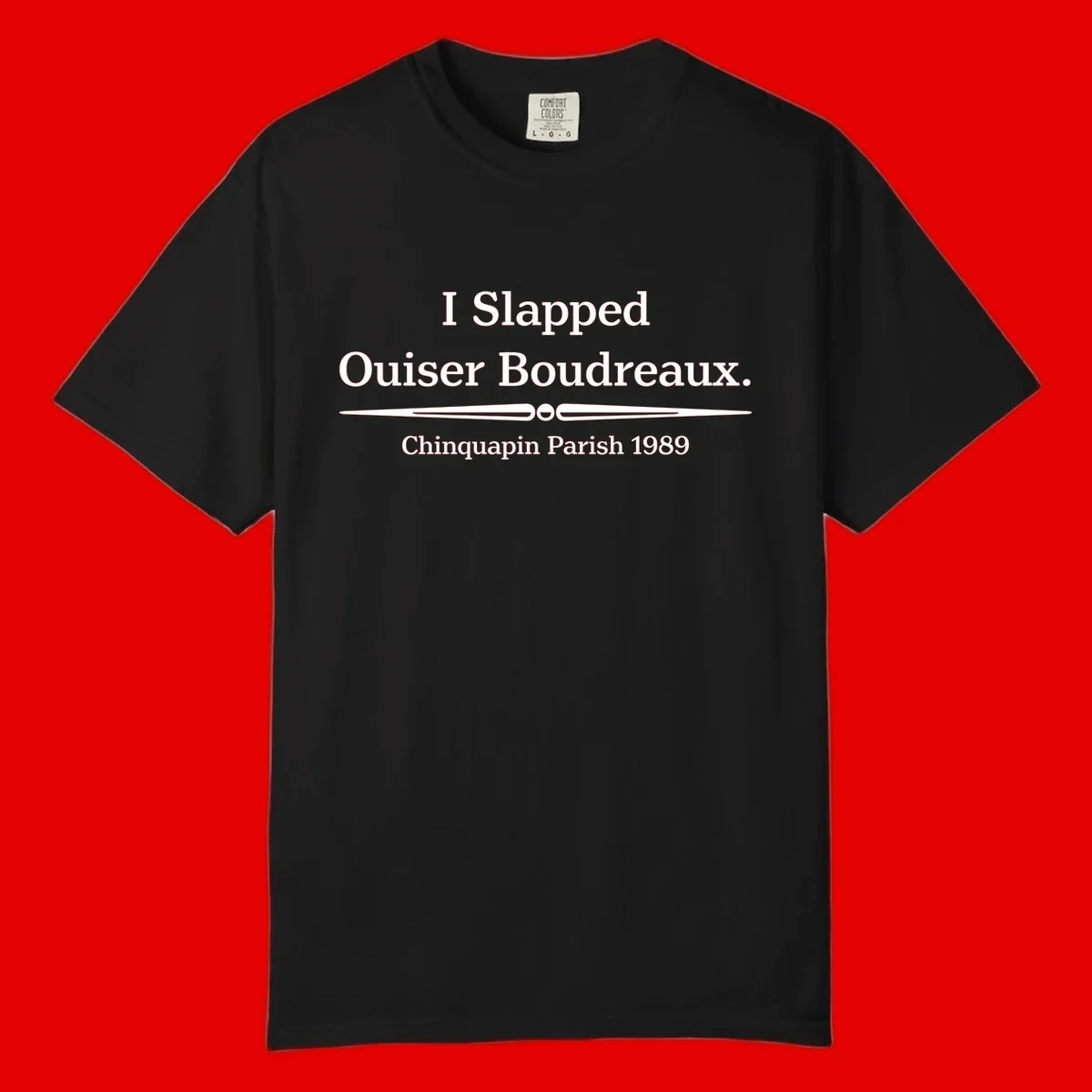 White text on gray background reading 'I Slapped Ouiser Boudreaux. Chinquapin Parish 1989' with decorative line divider