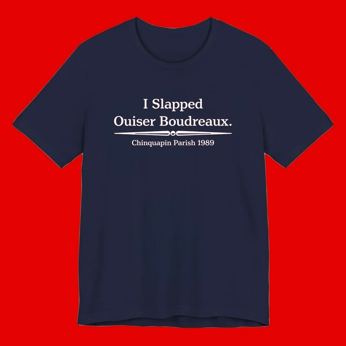 White text on gray background reading 'I Slapped Ouiser Boudreaux. Chinquapin Parish 1989' with decorative line divider