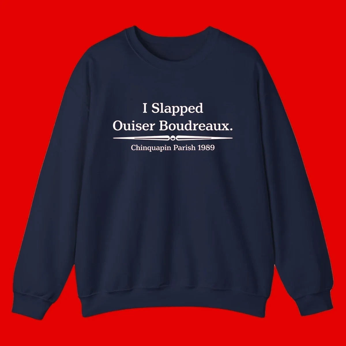 White text on gray background reading 'I Slapped Ouiser Boudreaux. Chinquapin Parish 1989' with decorative line divider