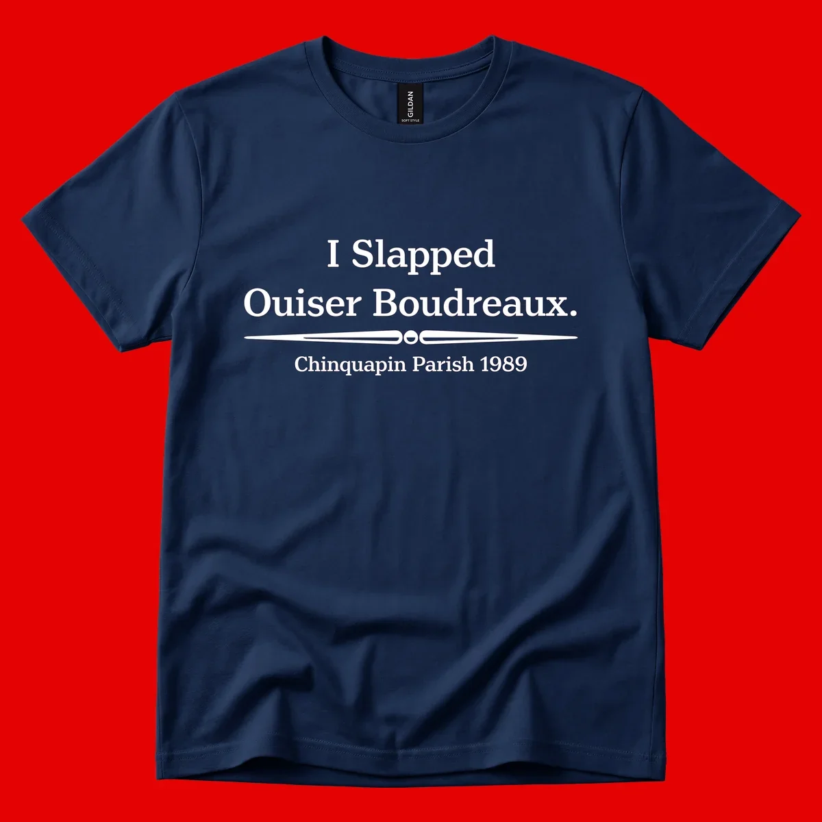 White text on gray background reading 'I Slapped Ouiser Boudreaux. Chinquapin Parish 1989' with decorative line divider