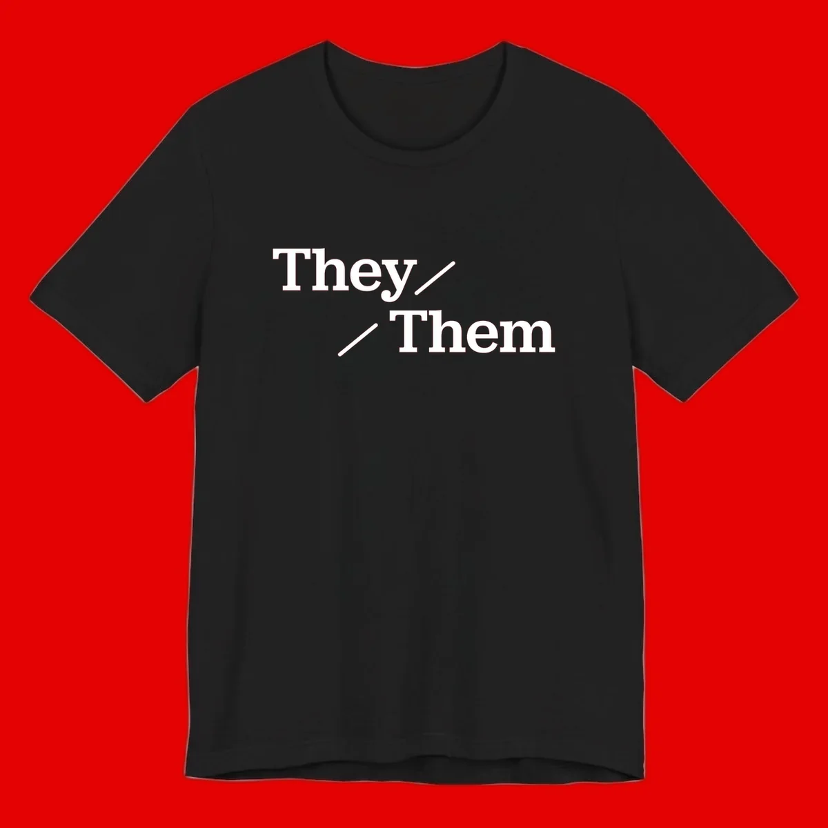 Minimalist design with white text reading 'They / Them' on gray background, celebrating gender-inclusive pronouns