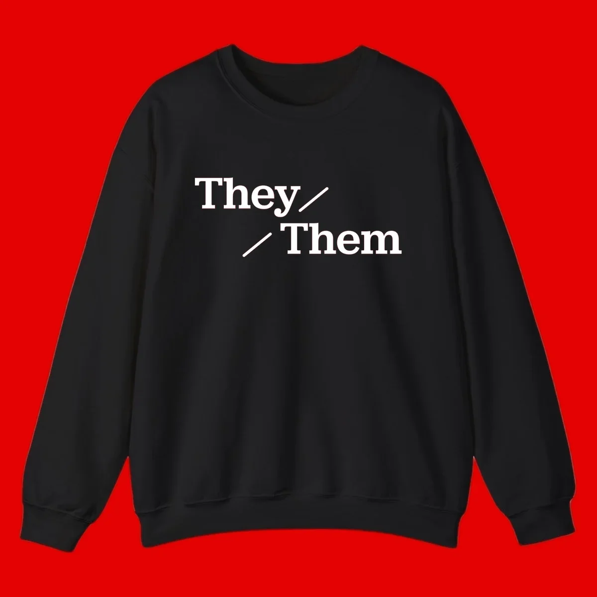 Minimalist design with white text reading 'They / Them' on gray background, celebrating gender-inclusive pronouns