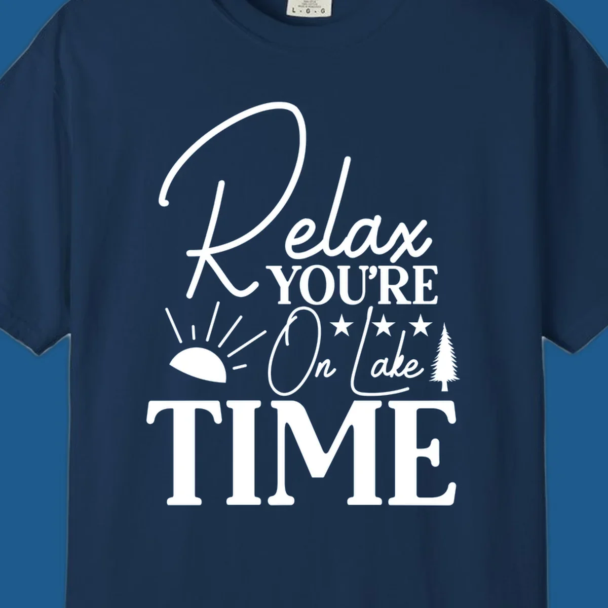 Relax You're On Lake Time text and graphics with sun rays and a pine tree.