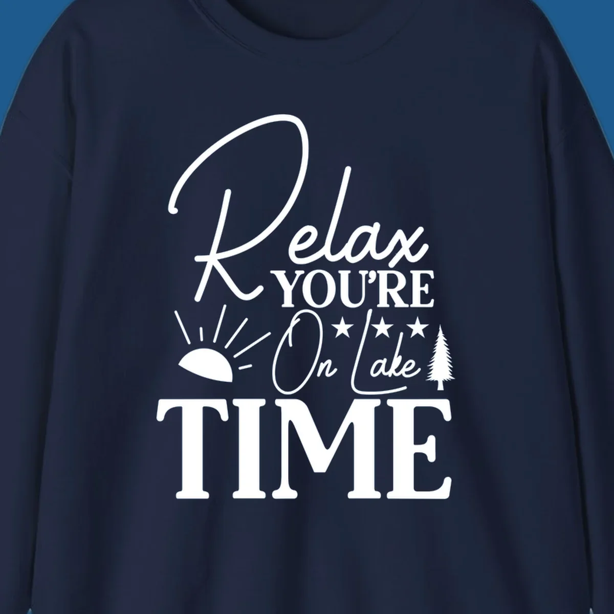 Relax You're On Lake Time text and graphics with sun rays and a pine tree.