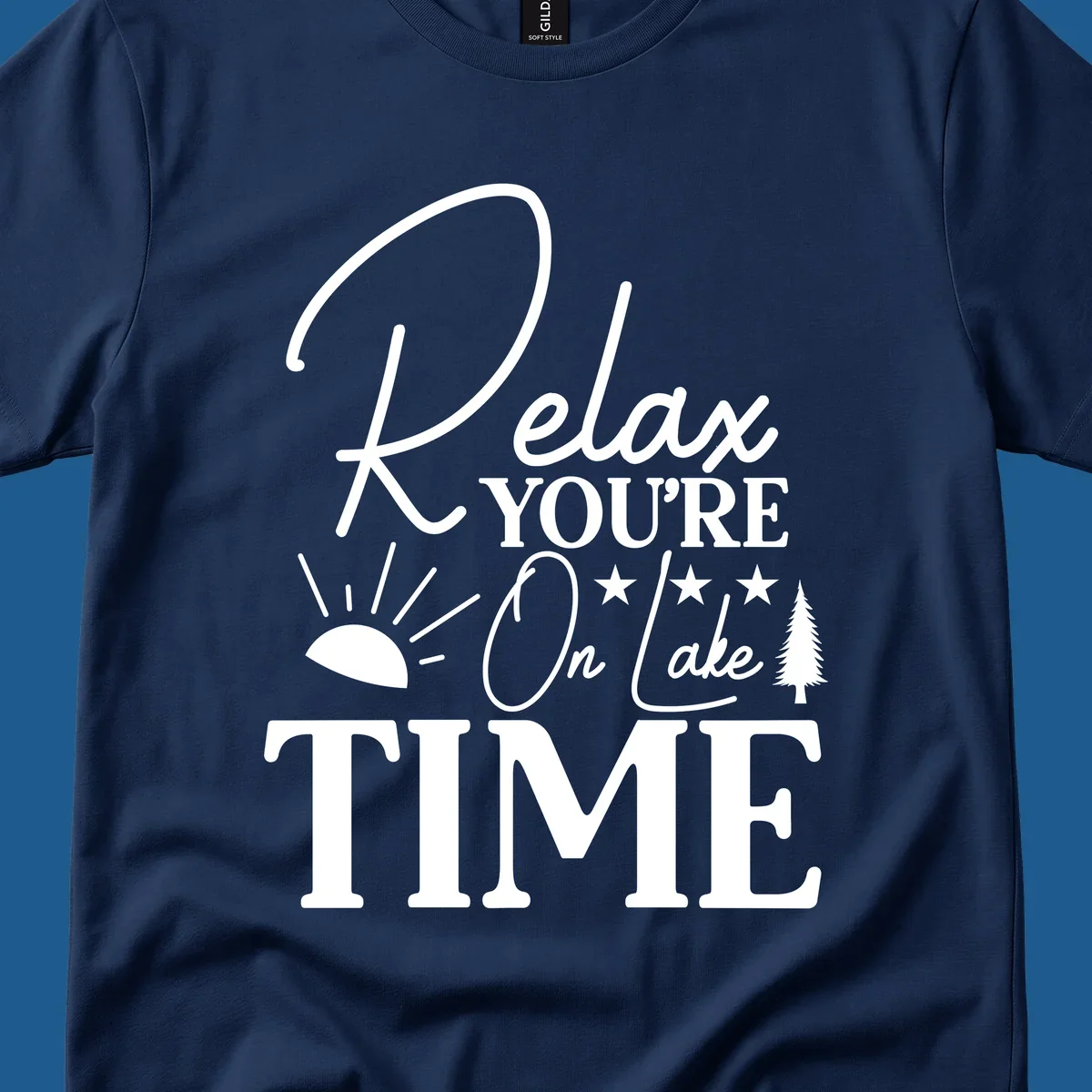 Relax You're On Lake Time text and graphics with sun rays and a pine tree.