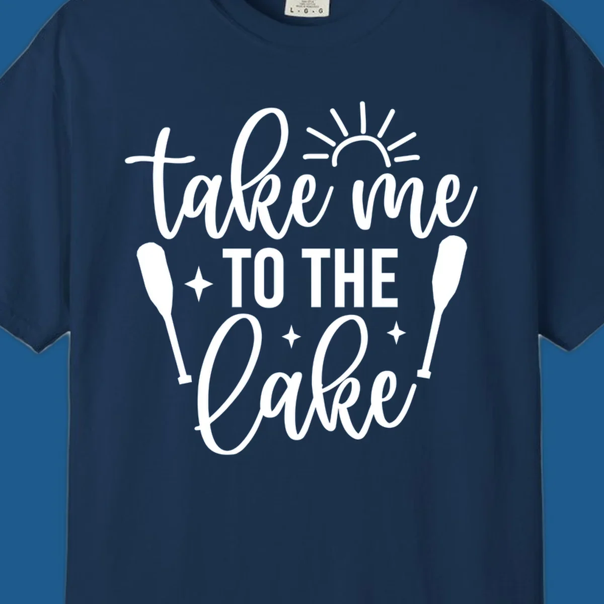 Typography design with 'take me TO THE Lake', sun, paddles, and stars for lake life vibes.