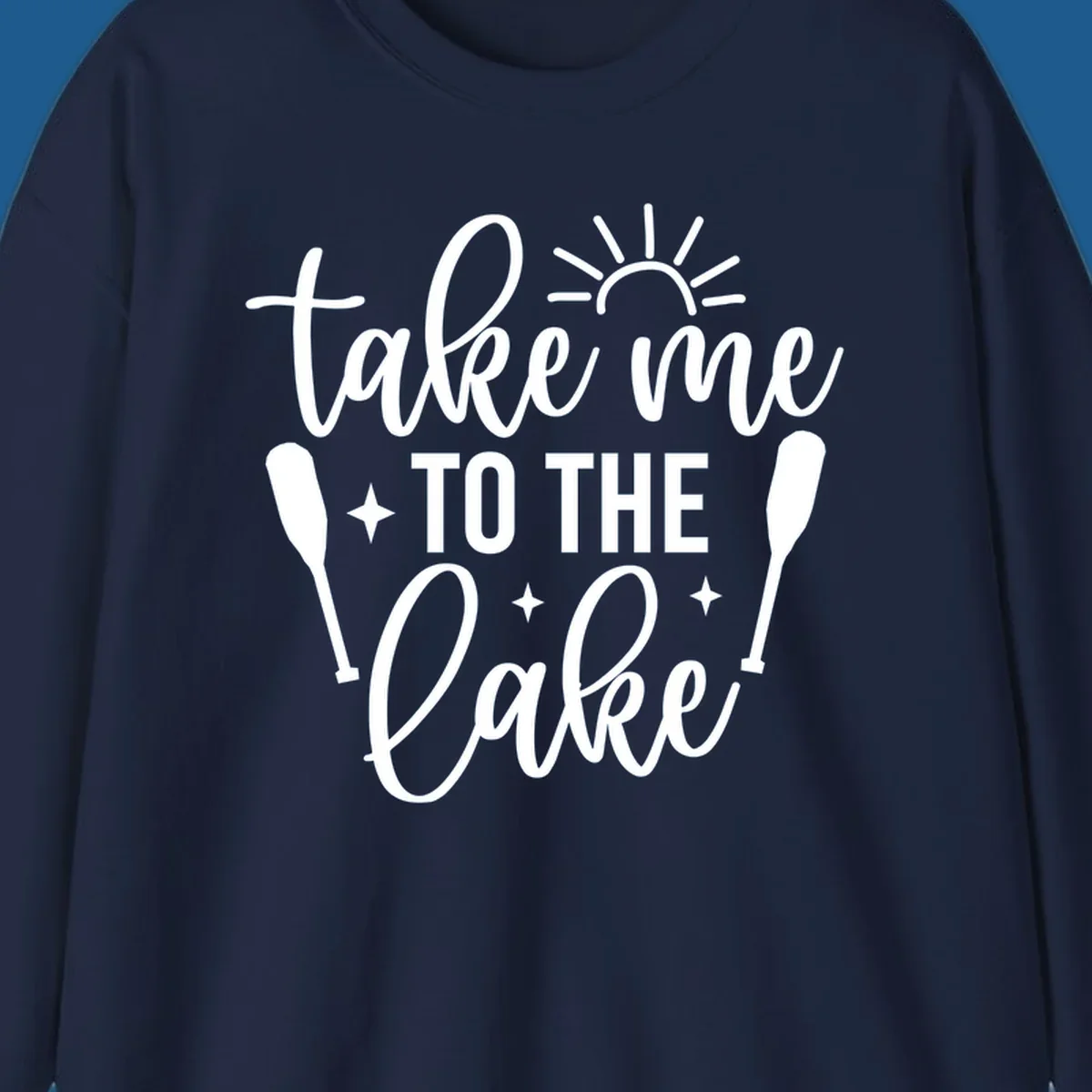 Typography design with 'take me TO THE Lake', sun, paddles, and stars for lake life vibes.
