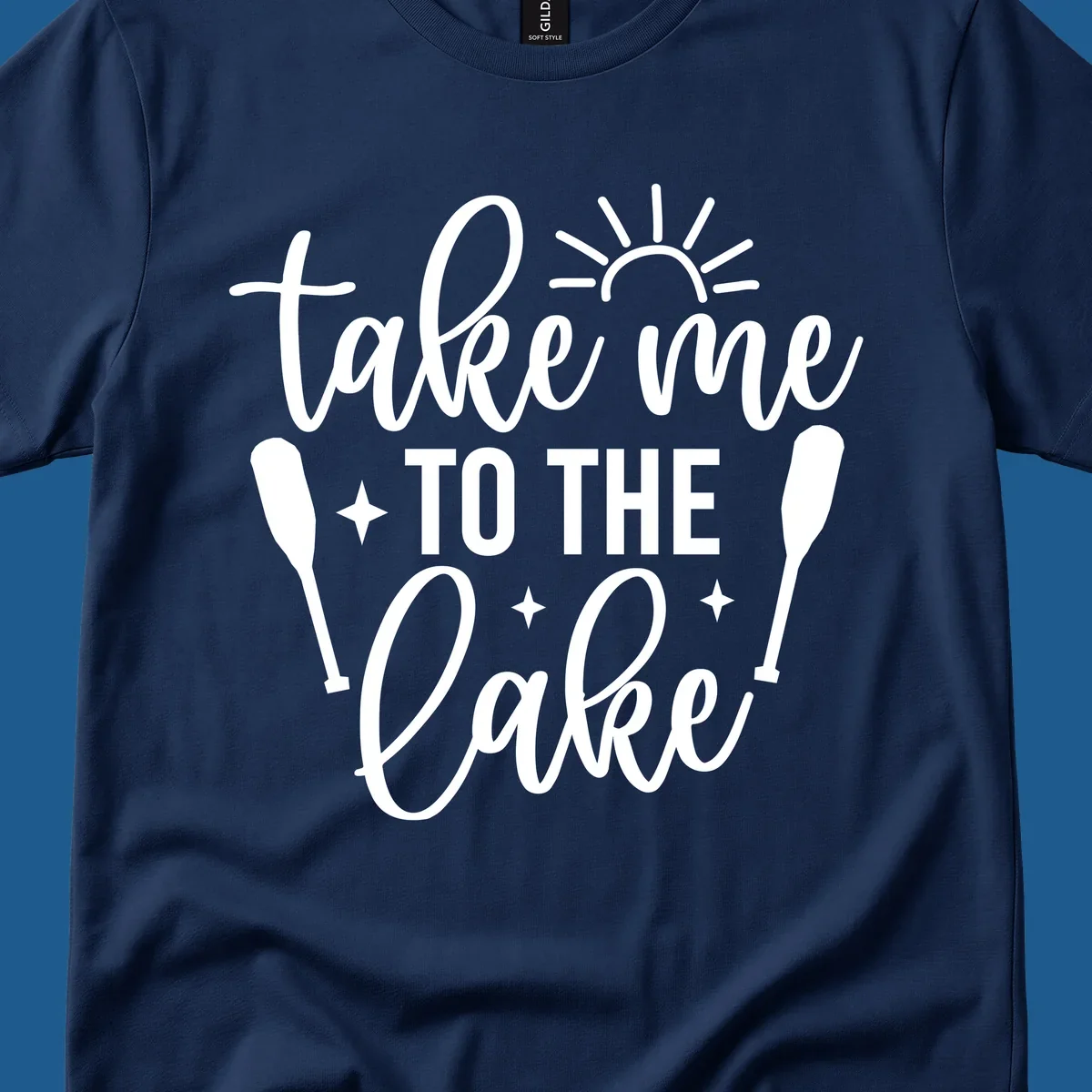 Typography design with 'take me TO THE Lake', sun, paddles, and stars for lake life vibes.