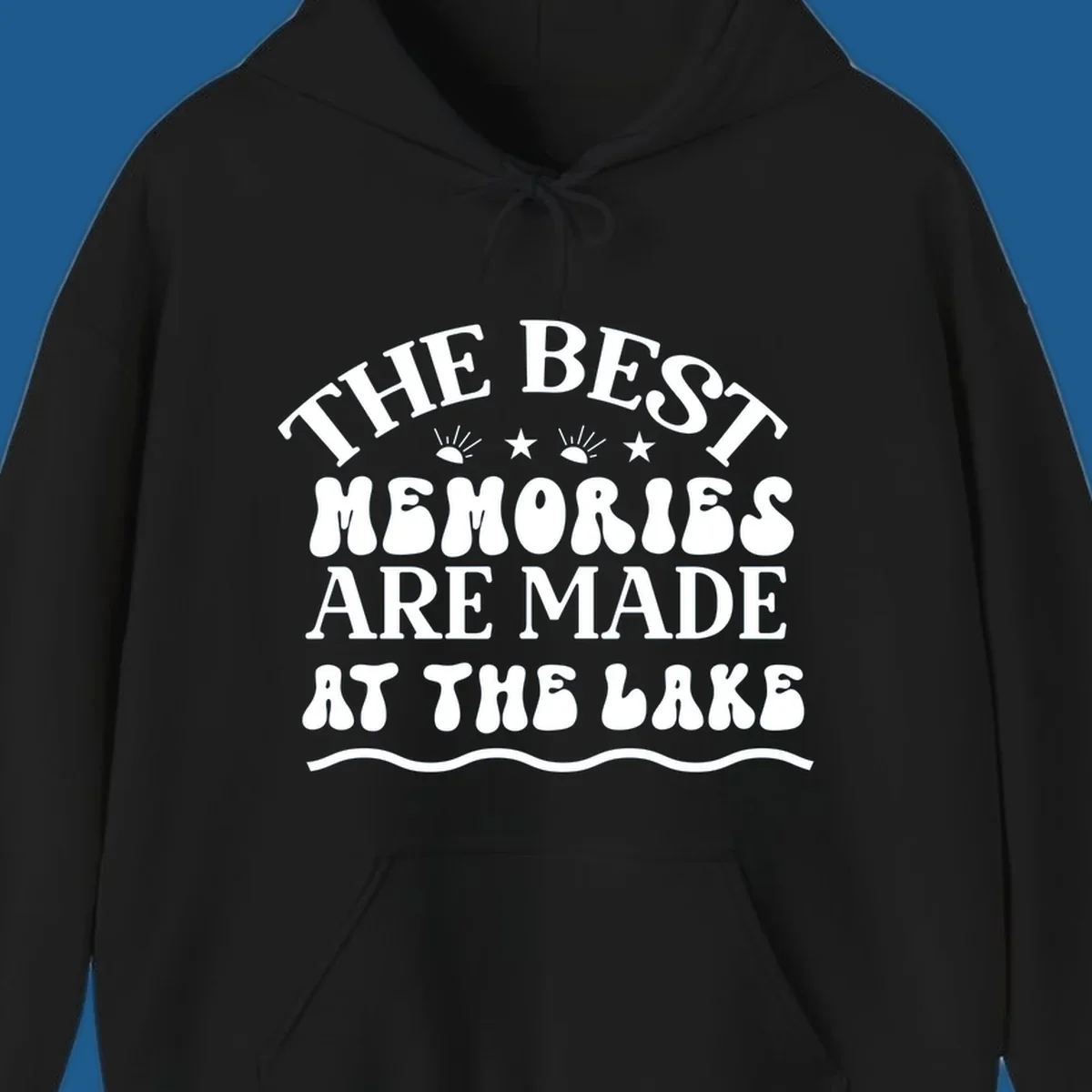Retro typography design 'The Best Memories Are Made At The Lake' with sun rays and stars.