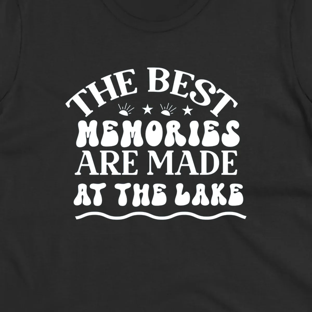 Retro typography design 'The Best Memories Are Made At The Lake' with sun rays and stars.