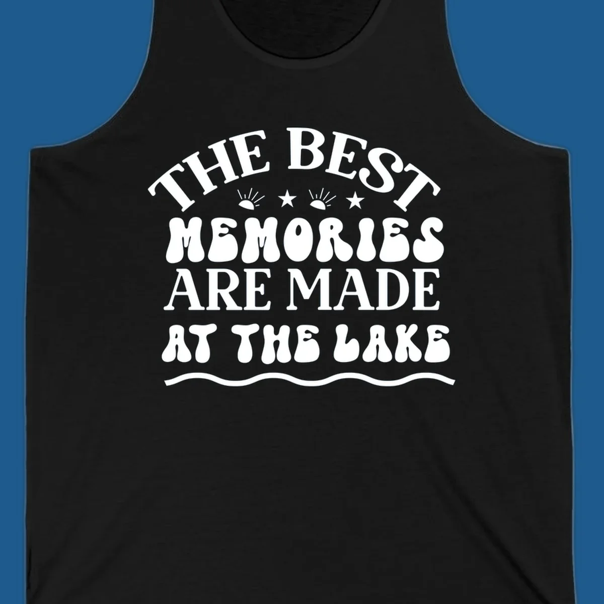 Retro typography design 'The Best Memories Are Made At The Lake' with sun rays and stars.