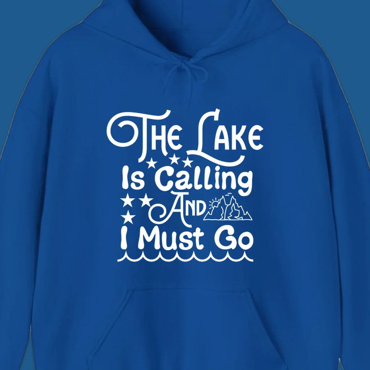 The Lake Is Calling And I Must Go text with mountains and water waves.