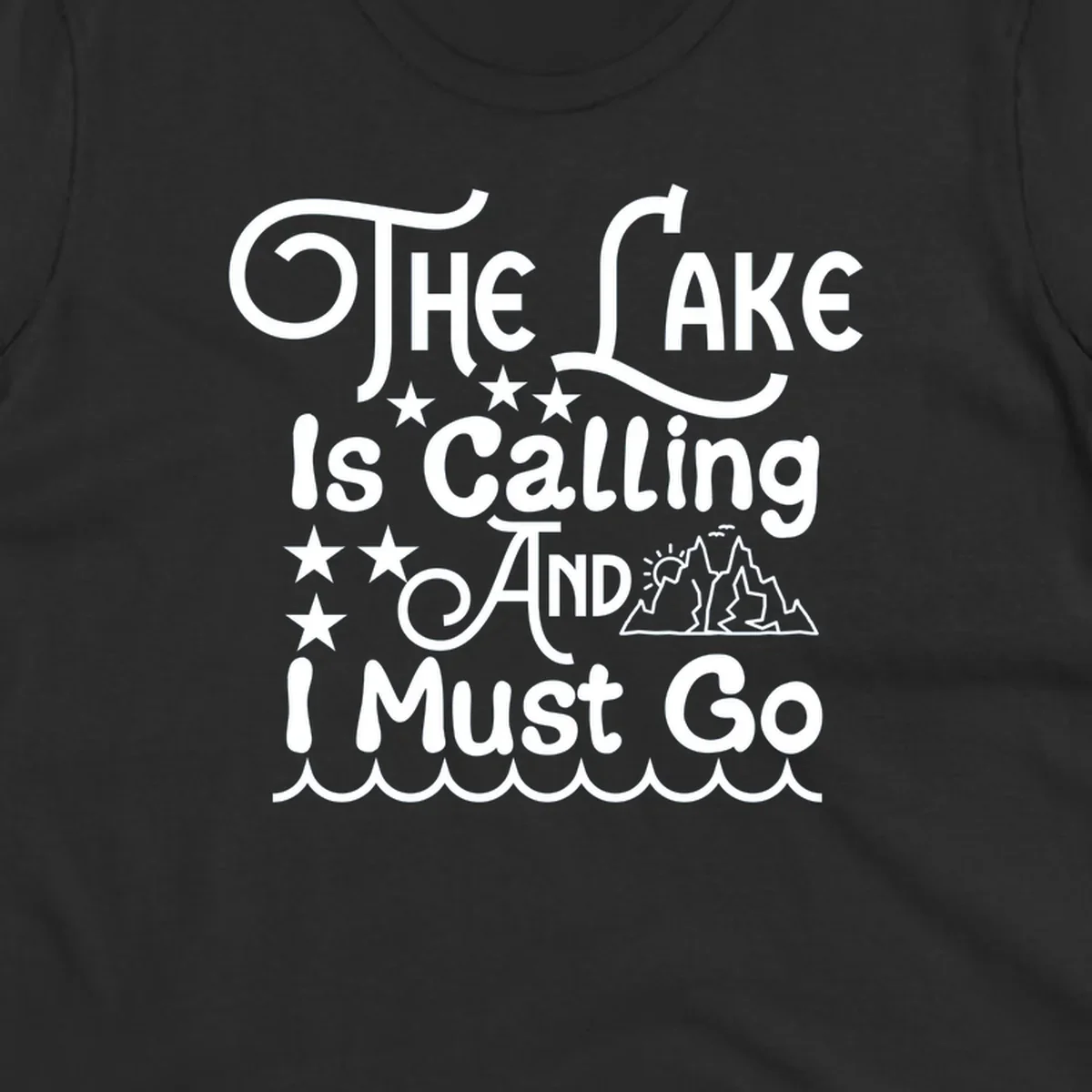 The Lake Is Calling And I Must Go text with mountains and water waves.