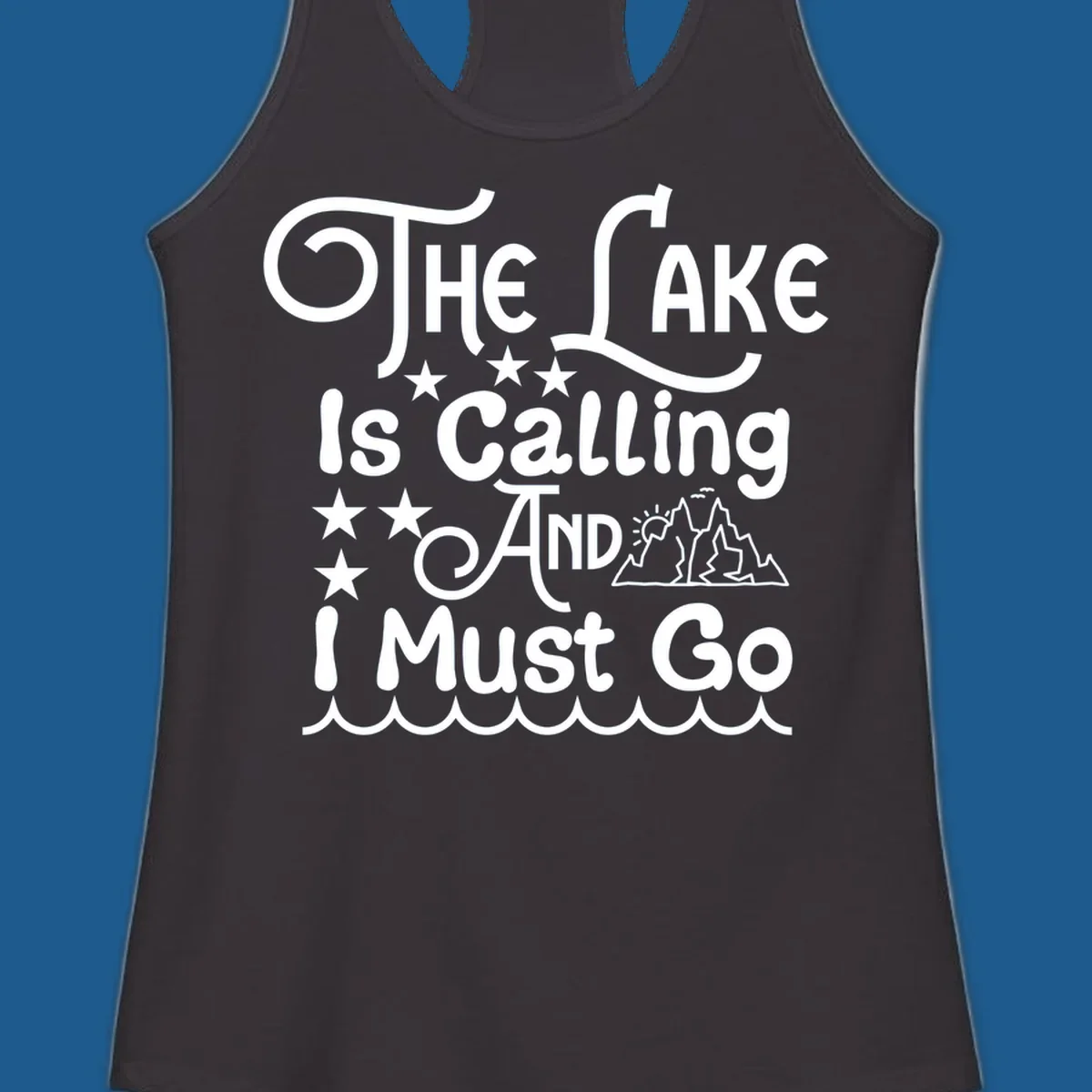 The Lake Is Calling And I Must Go text with mountains and water waves.