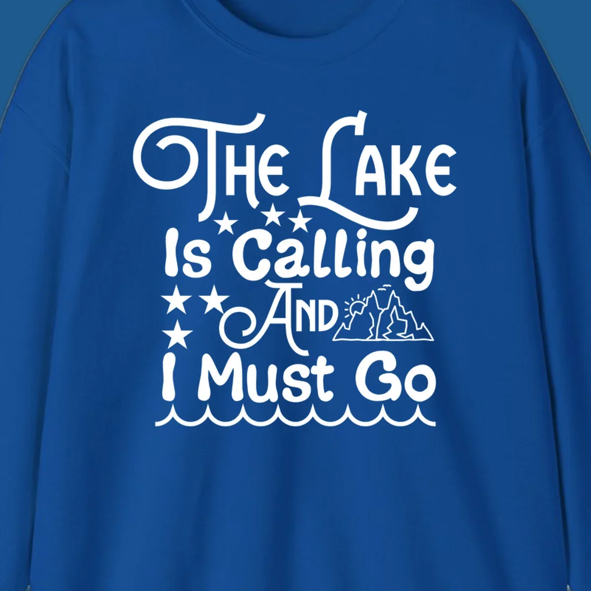 The Lake Is Calling And I Must Go text with mountains and water waves.