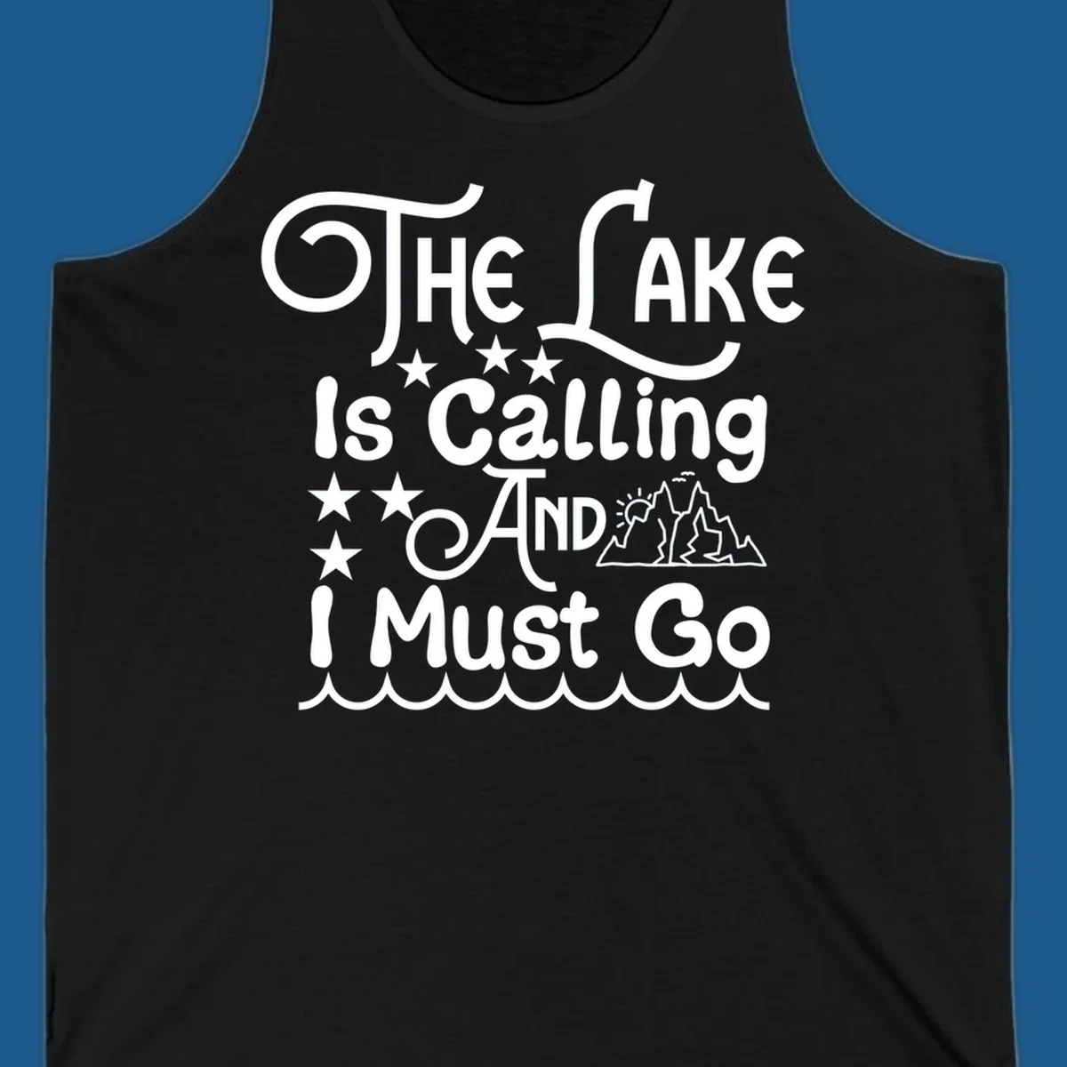 The Lake Is Calling And I Must Go text with mountains and water waves.