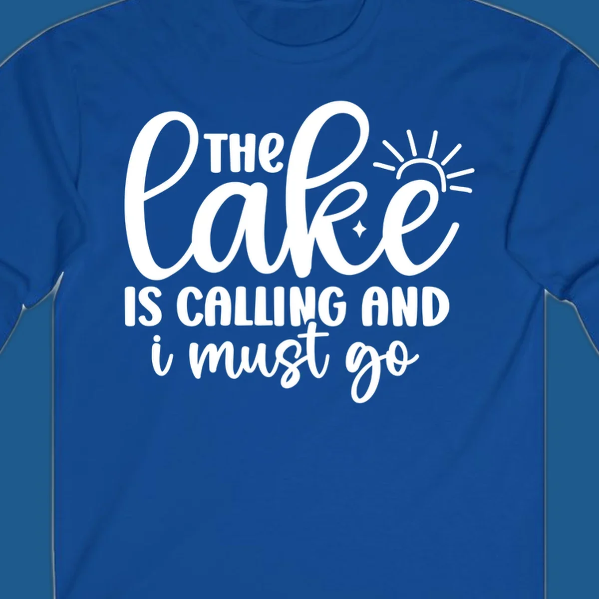 The lake is calling and I must go text with sun and star graphic