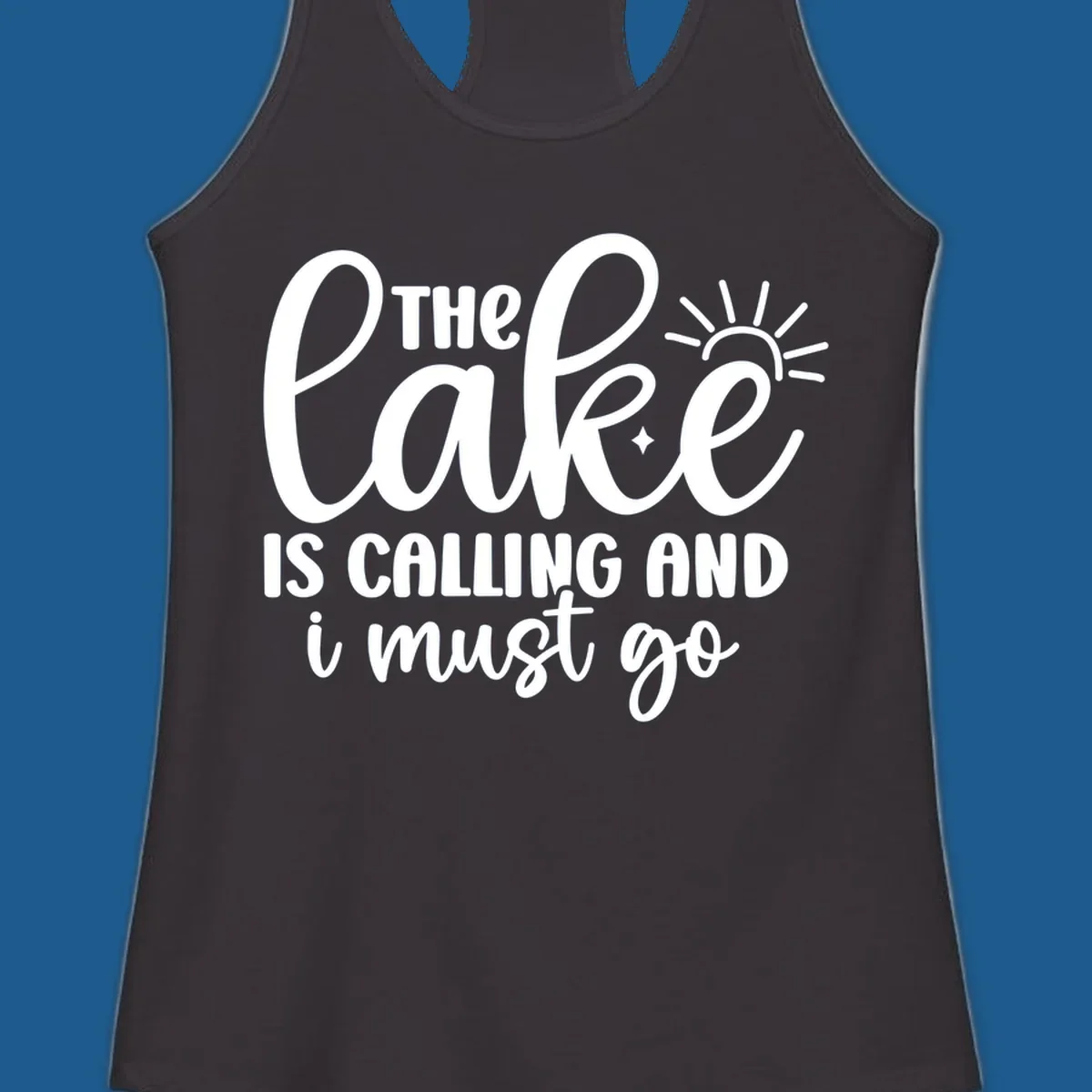 The lake is calling and I must go text with sun and star graphic