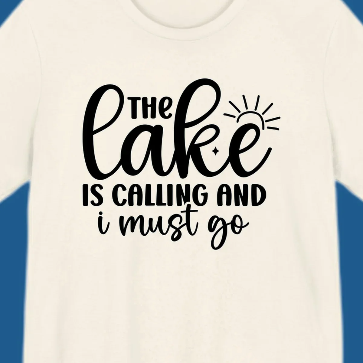 The lake is calling and I must go text with sun and star graphic