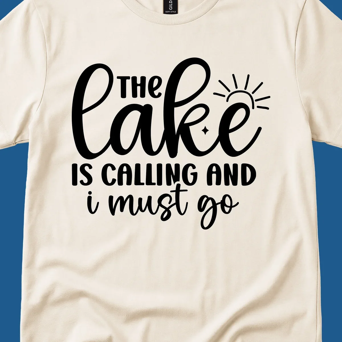 The lake is calling and I must go text with sun and star graphic