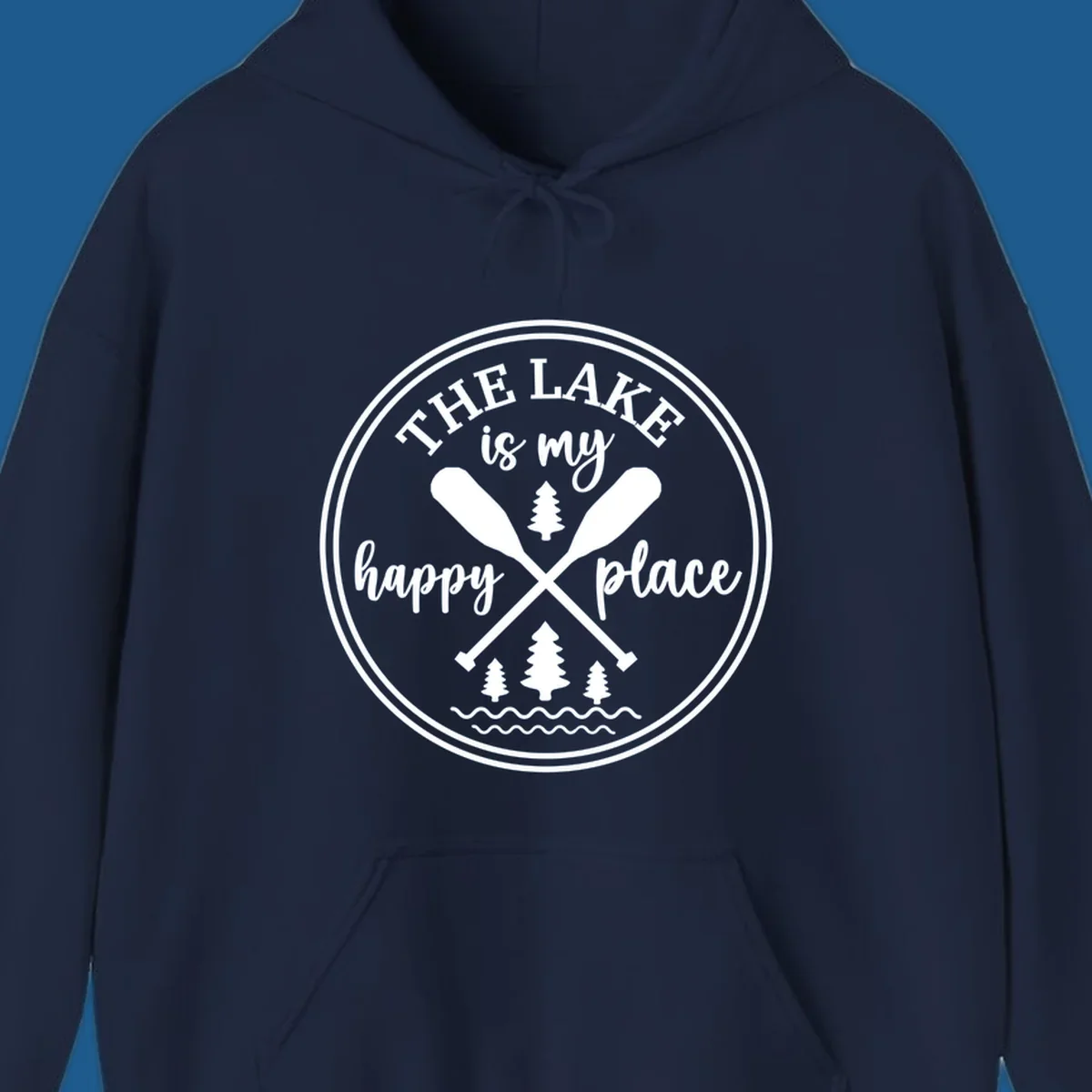 Circular graphic with text 'The Lake is my happy place', crossed oars, and pine trees - lake-happy-place.