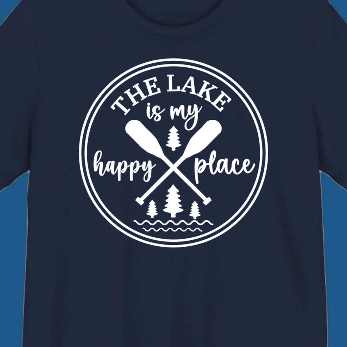 Circular graphic with text 'The Lake is my happy place', crossed oars, and pine trees - lake-happy-place.