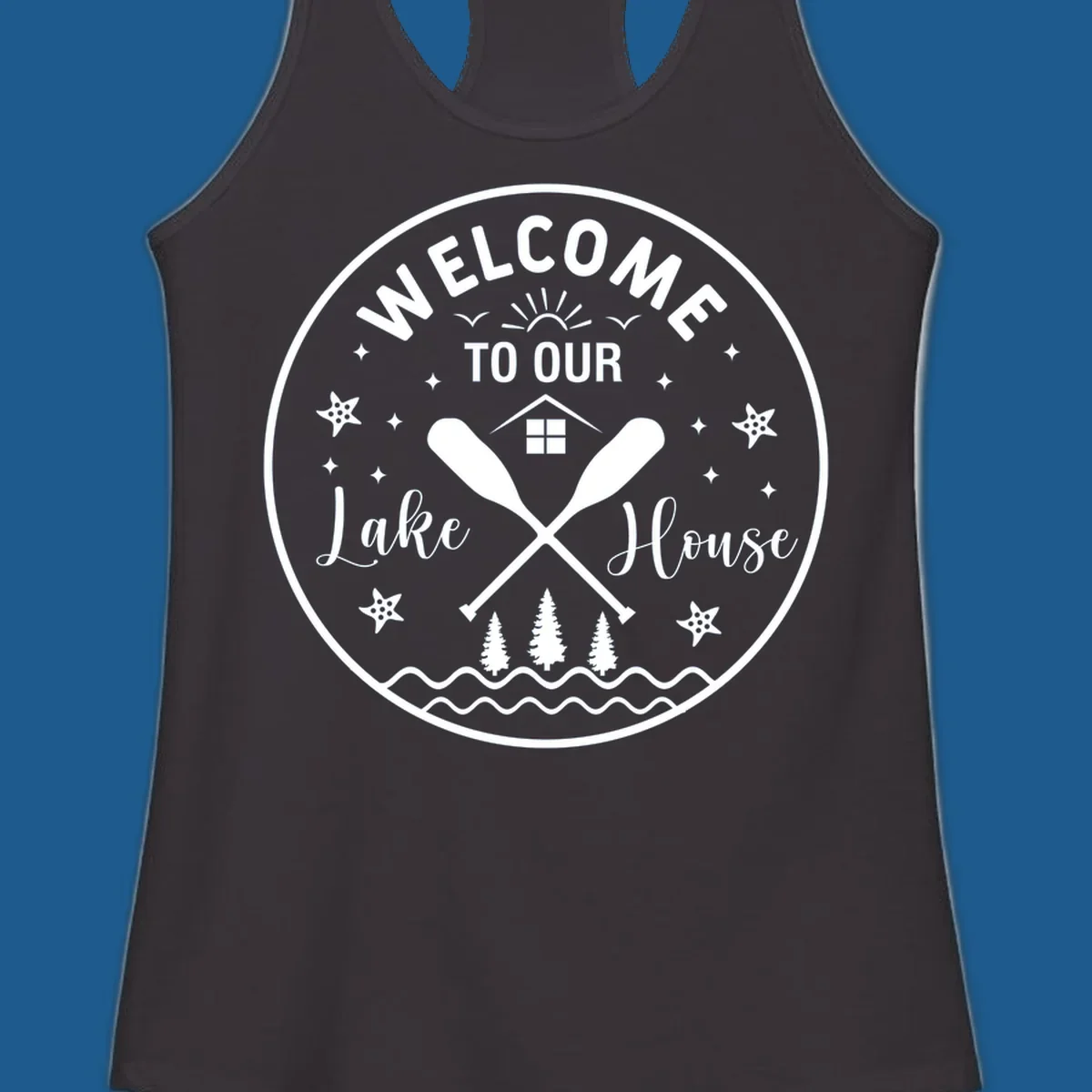 Welcome to our lake house circular design with oars, house, trees, and text.