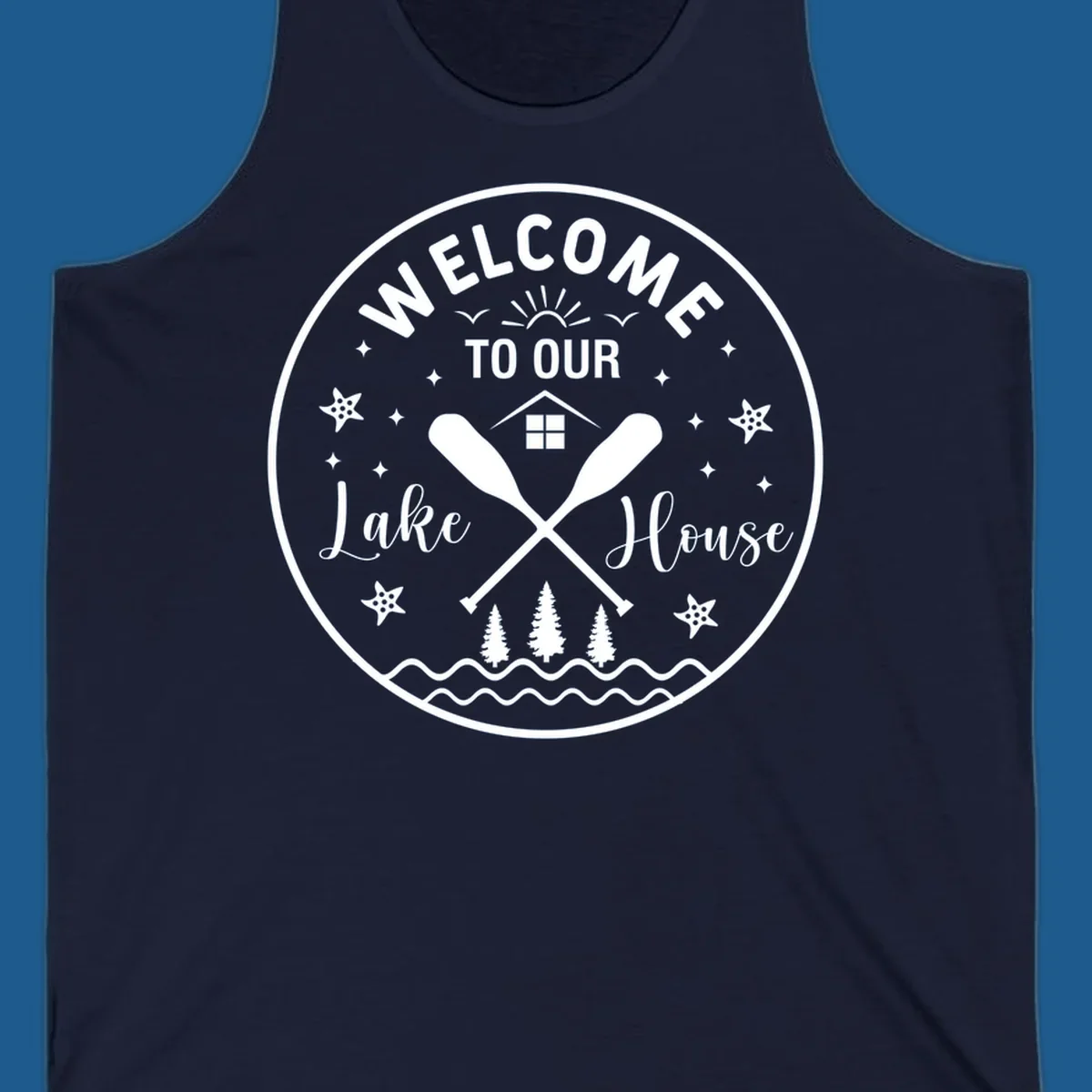 Welcome to our lake house circular design with oars, house, trees, and text.