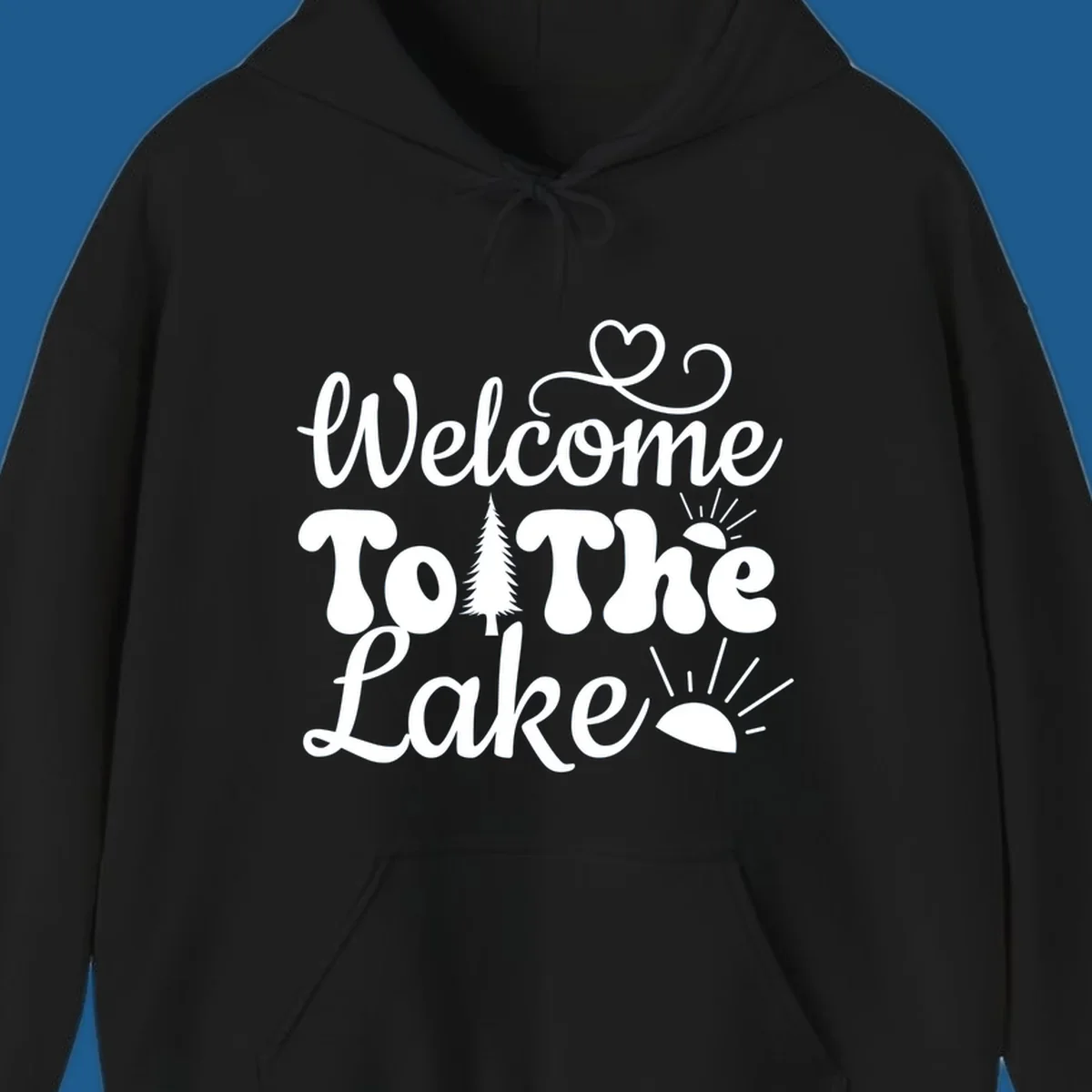 Welcome to the lake typography design with tree and sun graphics.