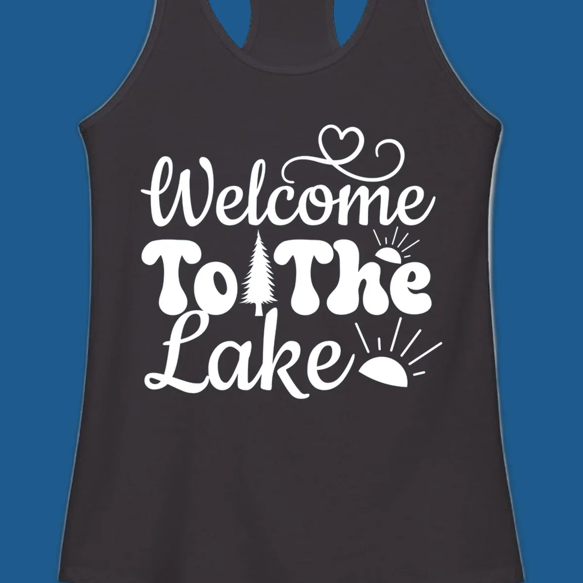 Welcome to the lake typography design with tree and sun graphics.